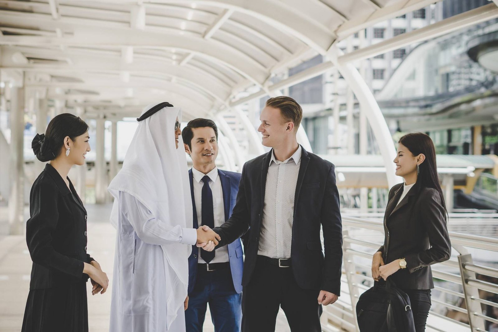 Portrait Business Partners Greeting One Another By Handshaking Way Office 1 Scaled